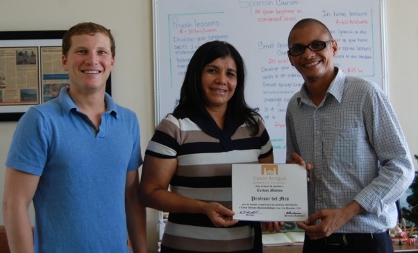 Corvan (on the right) receiving Teacher of the Month from Educational Director Eddalia Gonzalez and Director David Gold